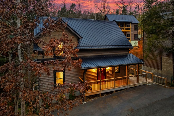 Exterior: Embrace mountain sunsets from your private deck in this charming log cabin!