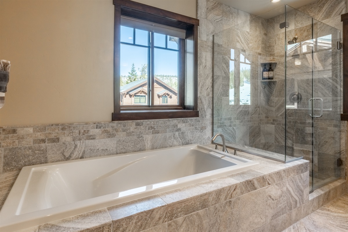 The primary bathroom delivers privacy and luxury with a spacious walk-in shower, a relaxing soaking tub, and a separate toilet room—perfect for starting or ending your day in peace.