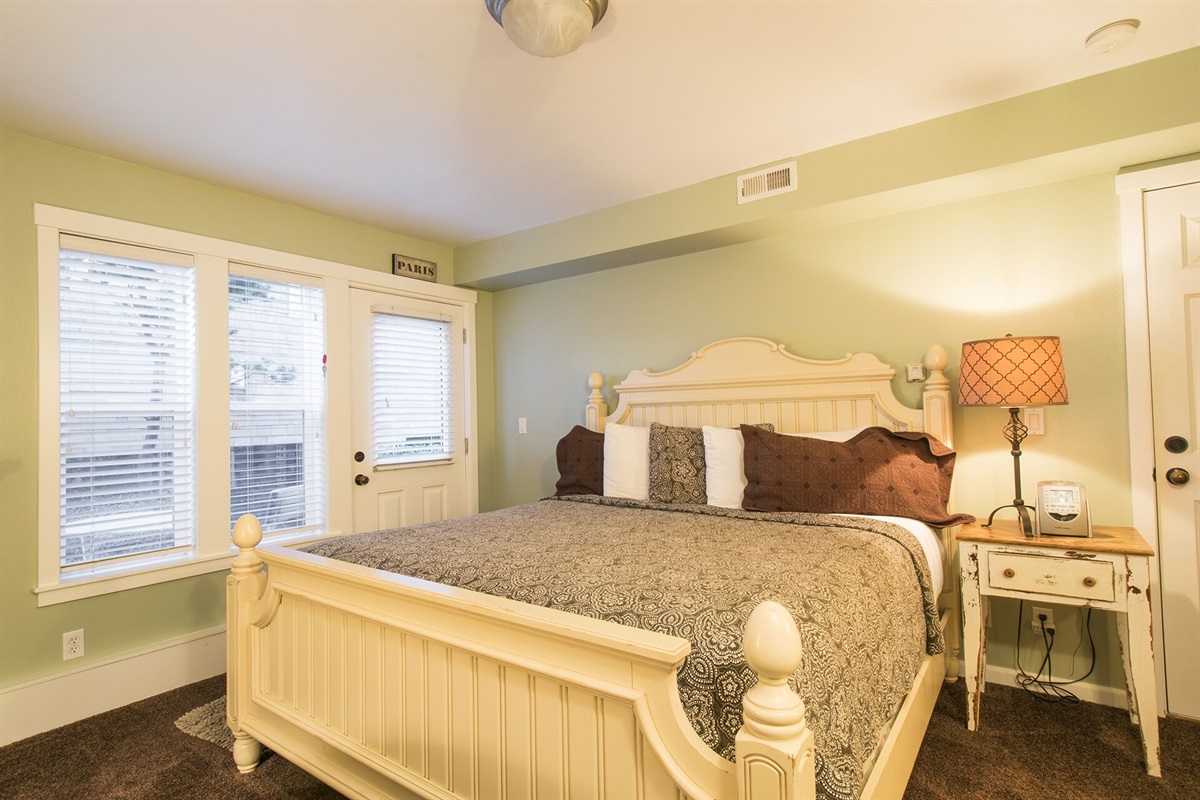 Paris Suite ~ The second master in the home, featuring its own private entrance, cozy fireplace, kitchenette, and Smart TV.