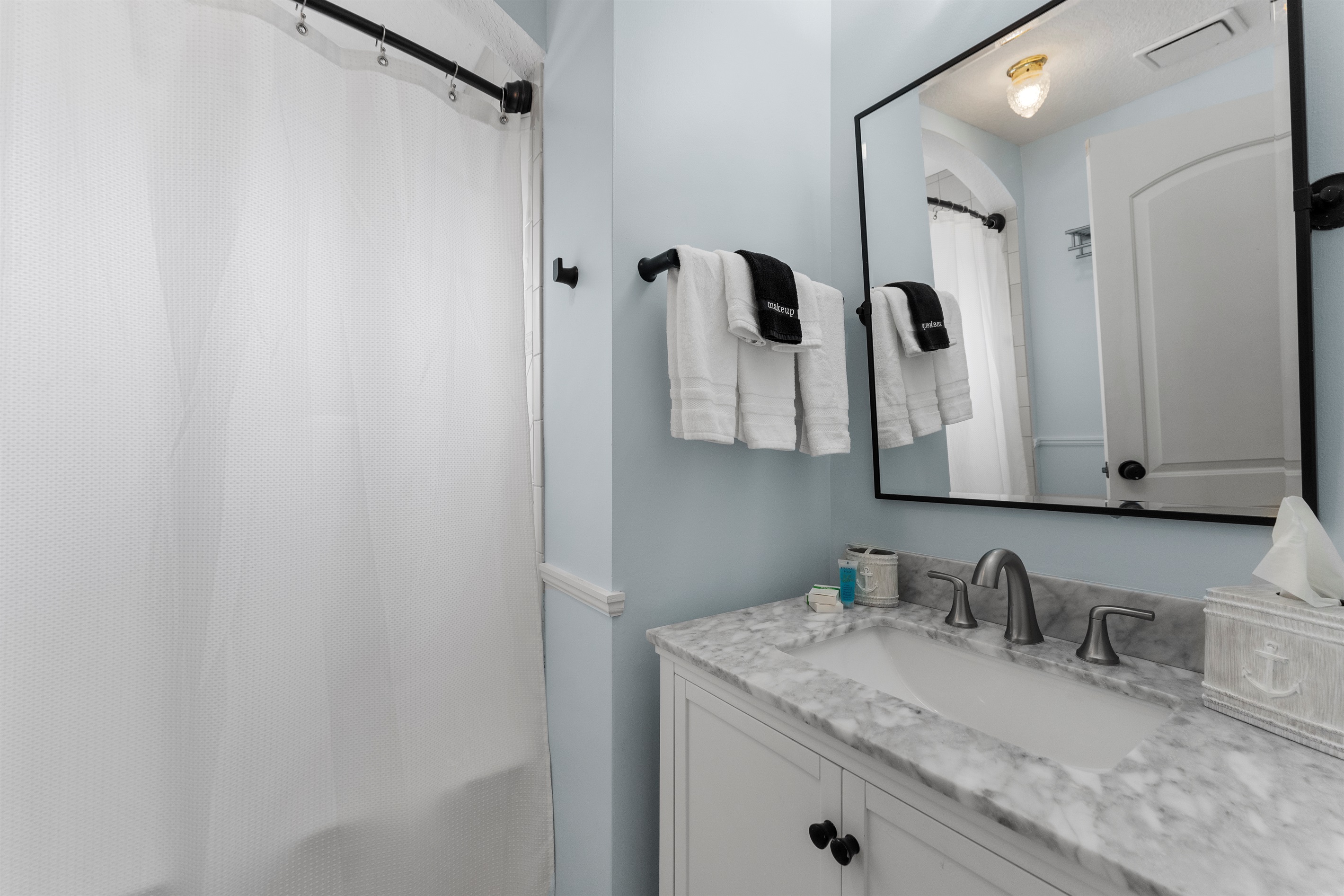 Upstairs hallway bathroom modern shower & tub combo with vanity