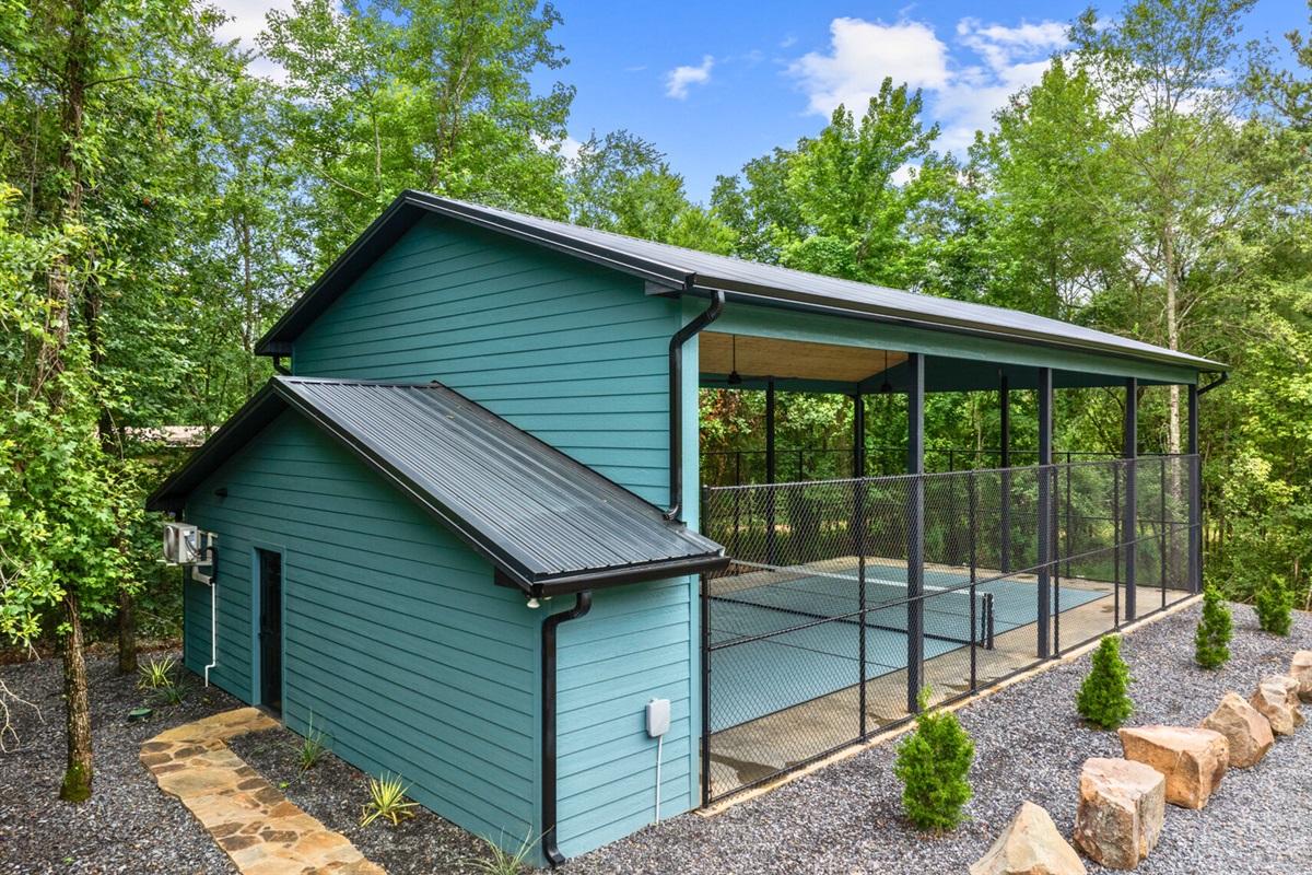 Check out this serene outdoor pickleball court, perfect for a fun game with friends in nature.