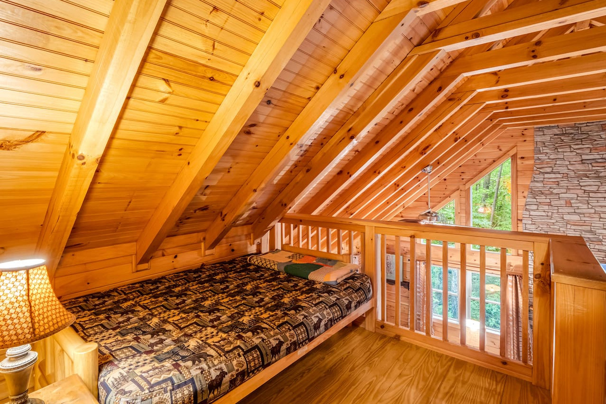 Charming loft sleeping nook, contains a twin bed, and overlooks the great room and dining area 