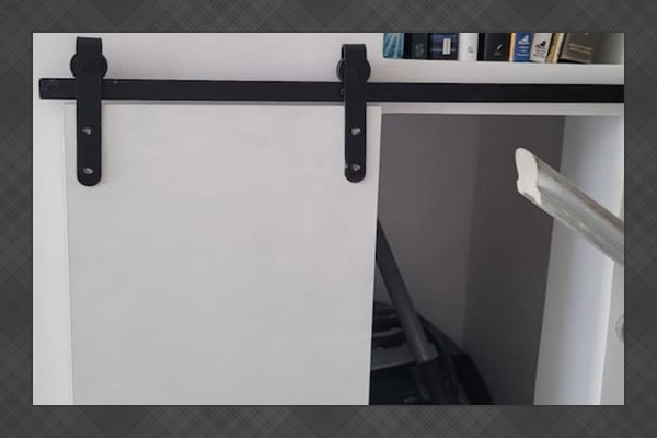 Bookshelves and a hidden compartment for the vacuum