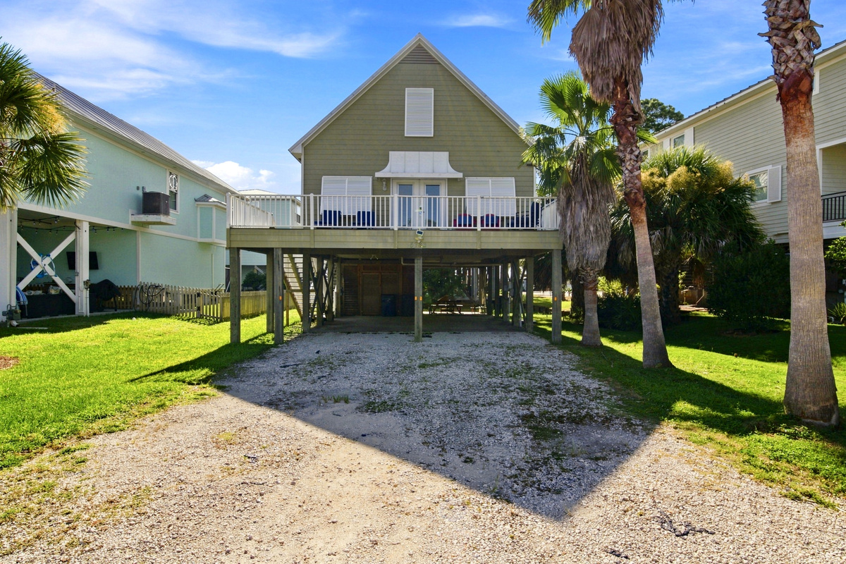 Covered parking underneath the home keeps vehicles shaded and out of the weather during your stay.