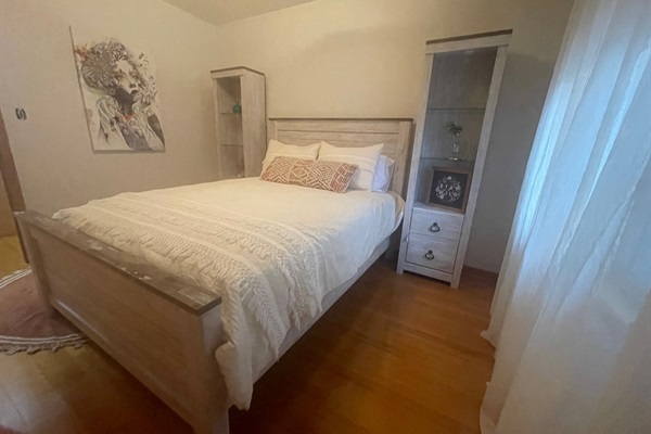 Second queen bedroom with tower night stands.