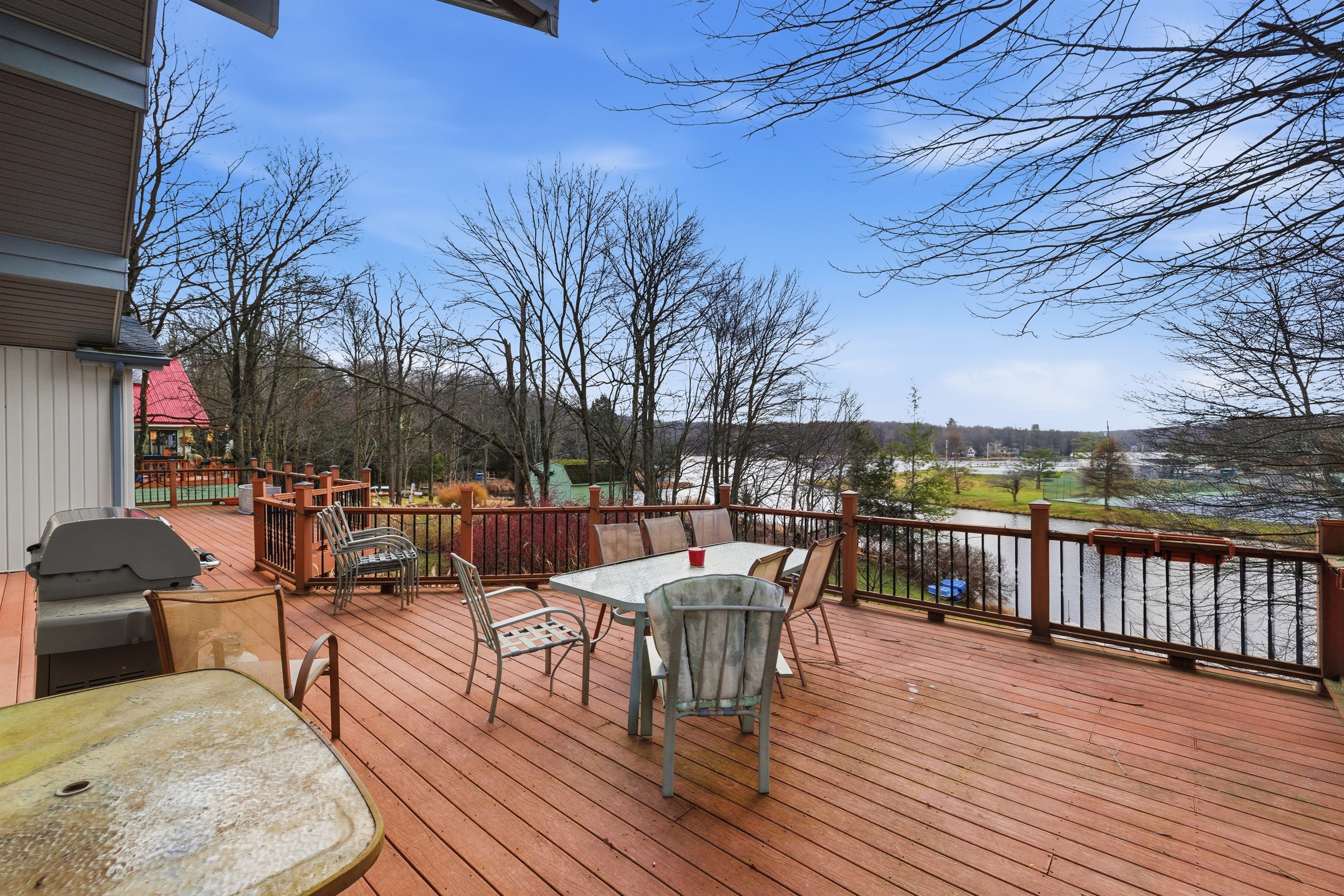 Deck overlooking the lake and Island complex.  Deck has BBQ grill and outdoor seating.