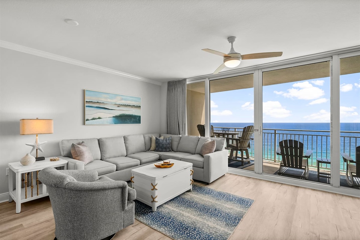 Relax in the bright and breezy living room with floor-to-ceiling Gulf views. Comfy seating, coastal decor, and direct balcony access make it the perfect place to unwind after a day in the sun.