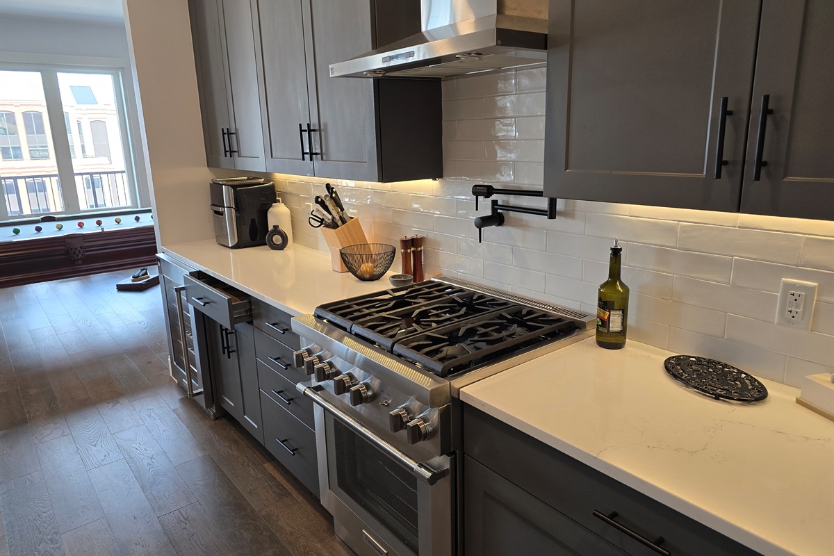 Full Kitchen With Professional Stove and Vent and lighting system