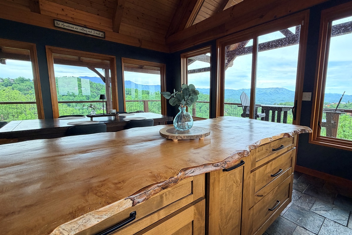 This cabin has so many unique features. Live edge countertops, Reclaimed doors, (Check out the theatre door), wood beams...oh and some views.