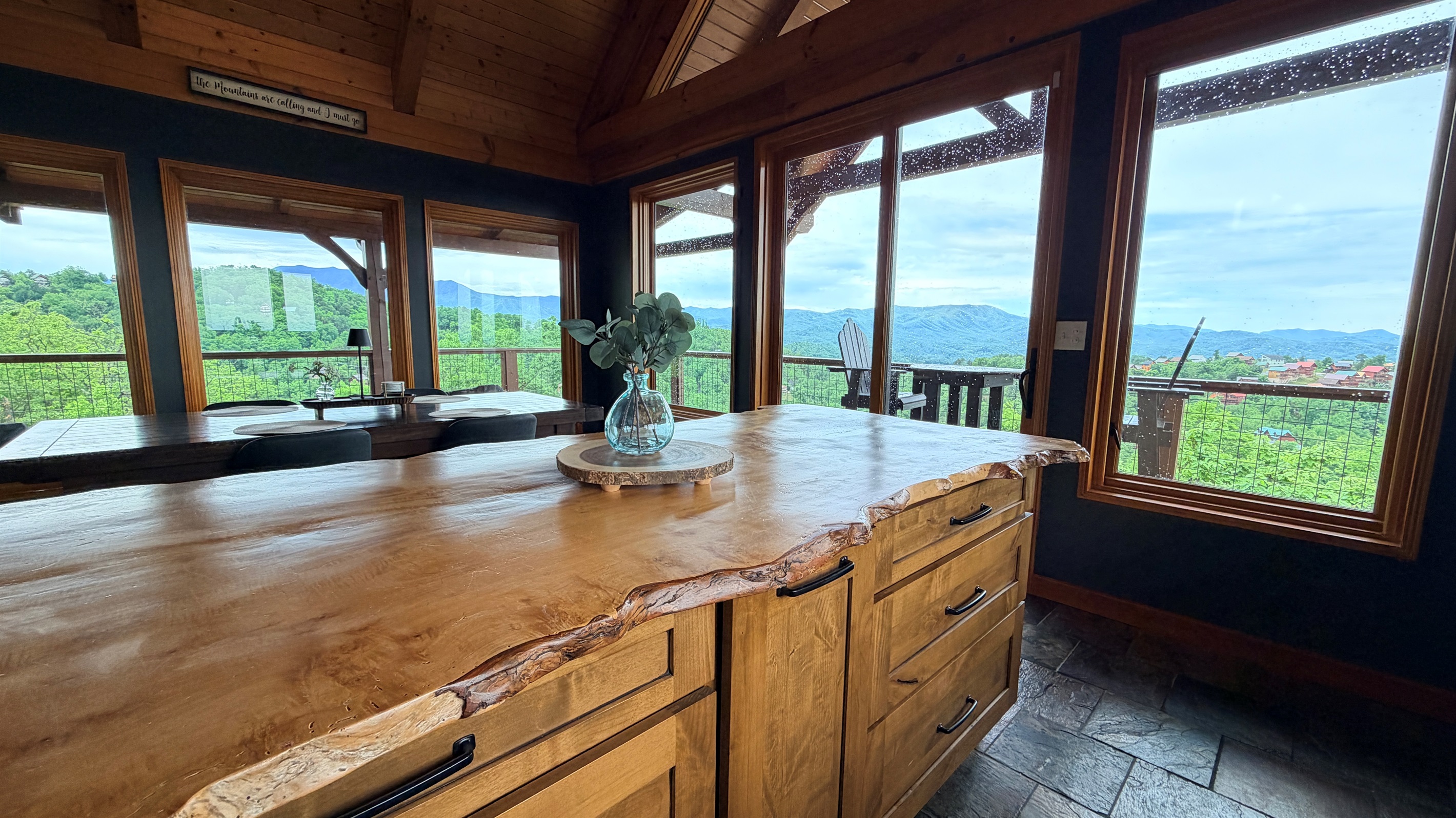 This cabin has so many unique features. Live edge countertops, Reclaimed doors, (Check out the theatre door), wood beams...oh and some views.