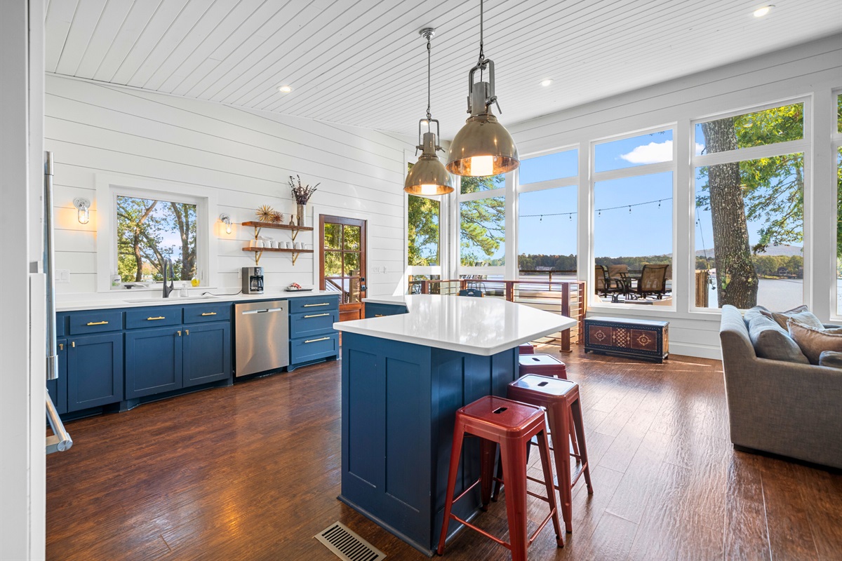 Bright kitchen corner with blue cabinets and sleek finishes to cook in style.