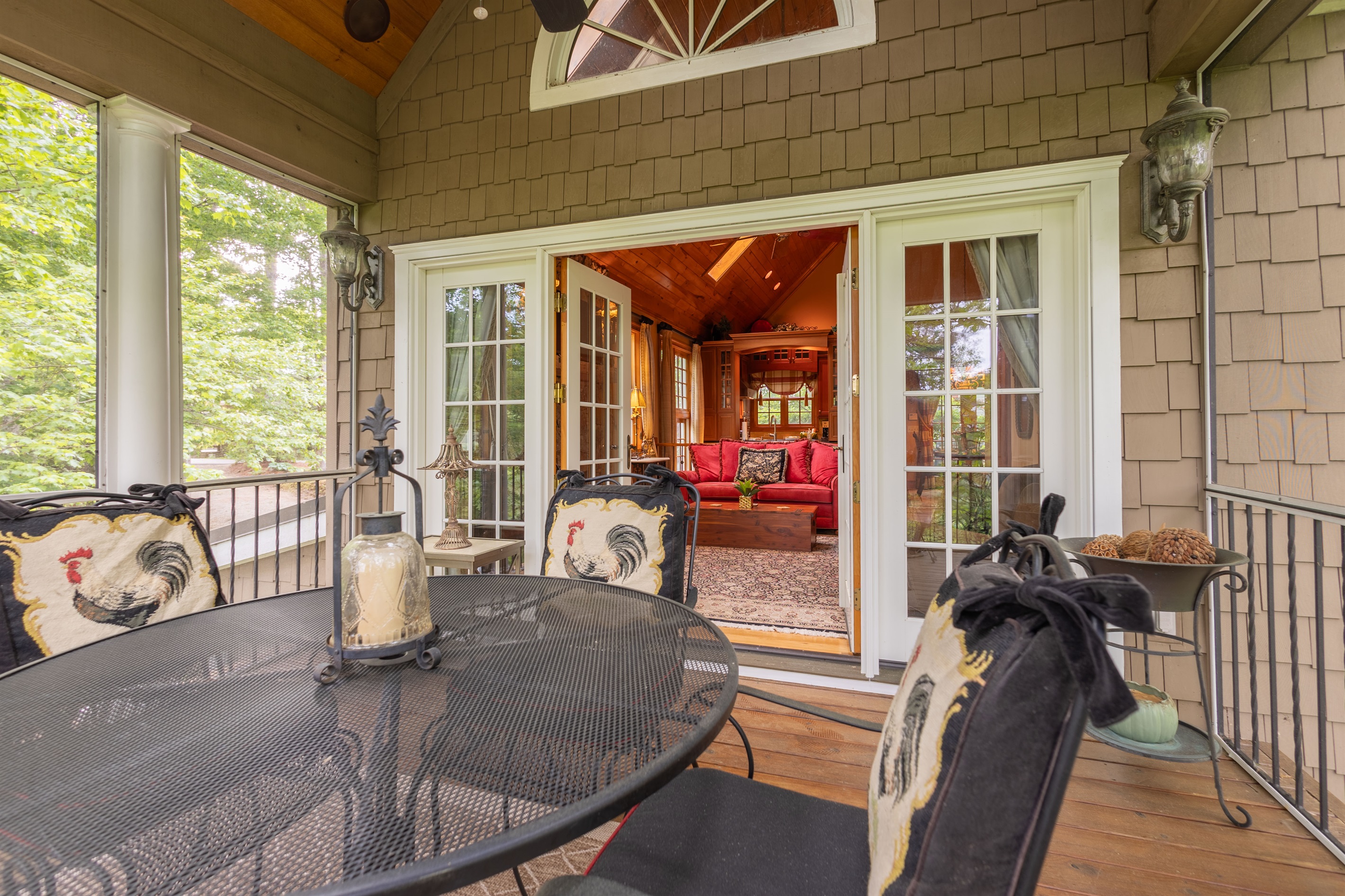 Open the French doors and seamlessly blend indoor comfort with outdoor relaxation on the spacious covered deck just off the living room.