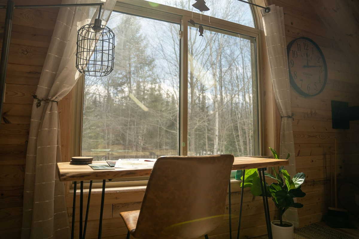 Upstairs living area is equip with an awesome working space.  This inspirational comfortable spot with its view will aid in creative writing, painting, or will serve as an office space away from the office.  