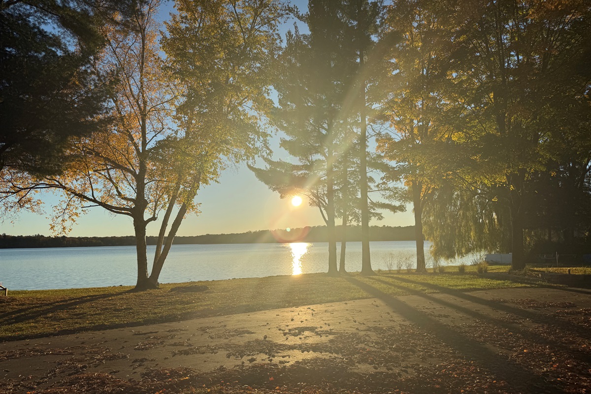 Welcome to 100' of sparkling lakefront at Lake Ann. Enjoy sunsets daily from the fire pit, deck or the house.