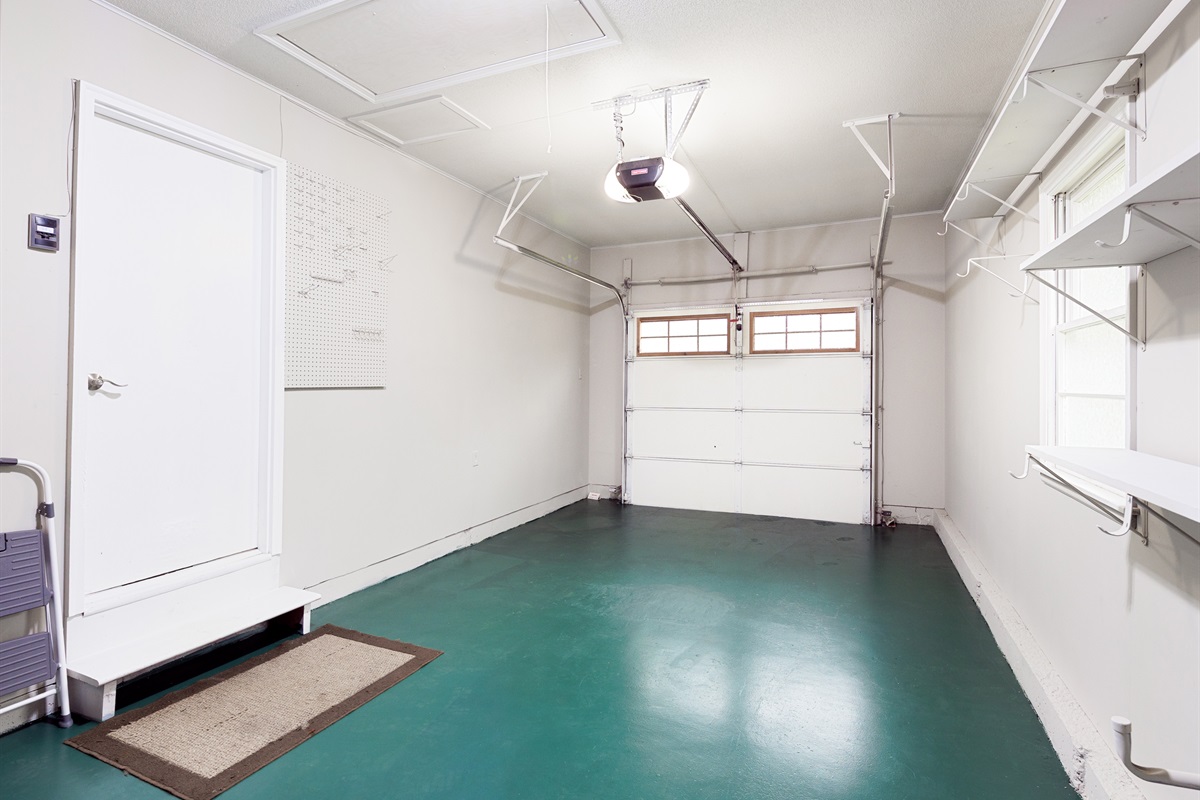 Attached garage with interior access and additional storage space.