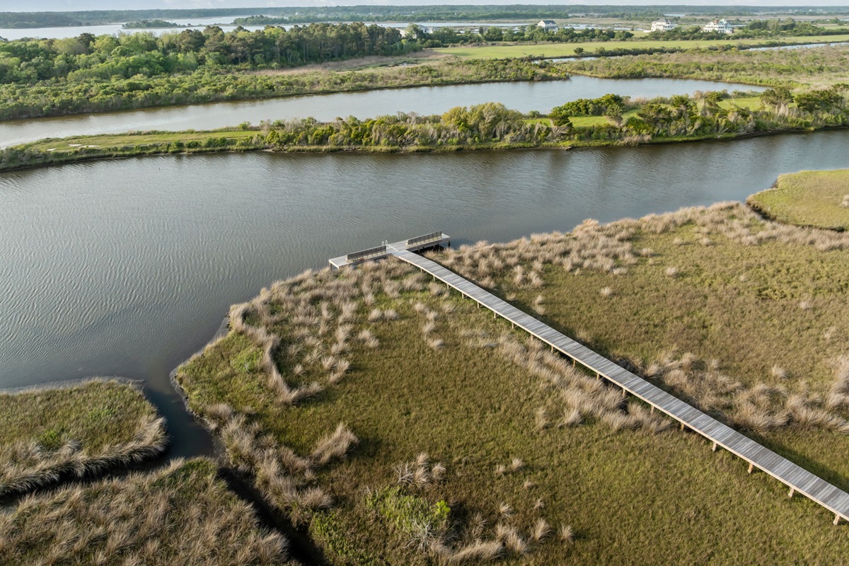 Private boardwalk leading to peaceful waterfront views&mdash;perfect for morning coffee or sunset unwinding