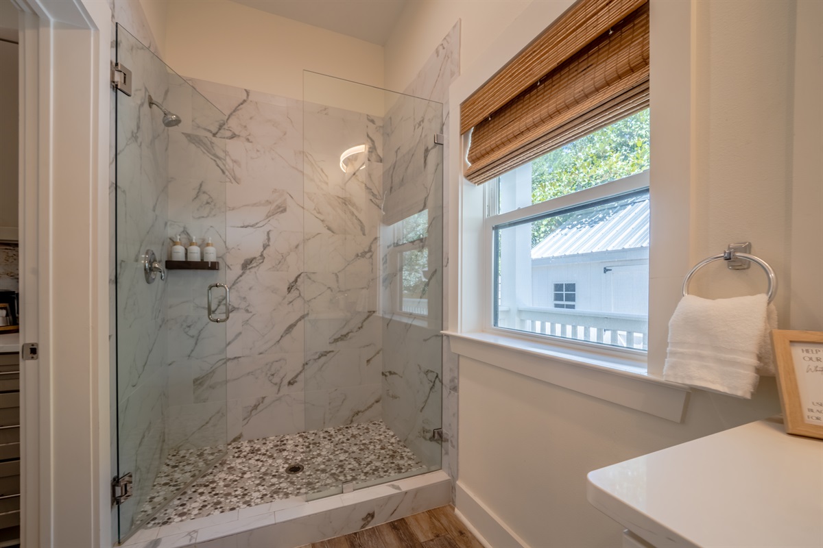 Jack and Jill full bathroom conveniently located between the kitchen and bedroom