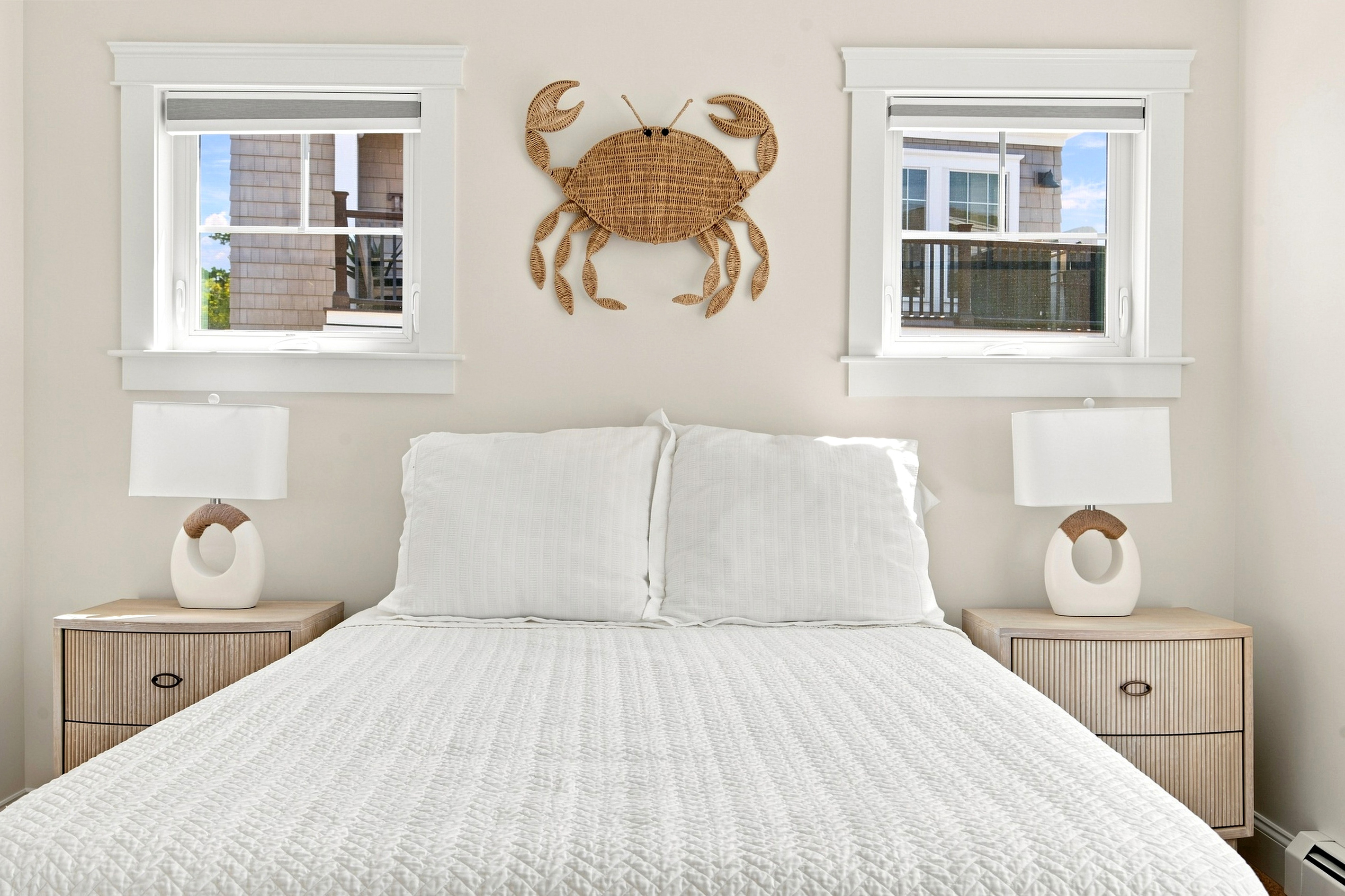 Coastal character and natural light create a welcoming bedroom retreat with a playful seaside touch.