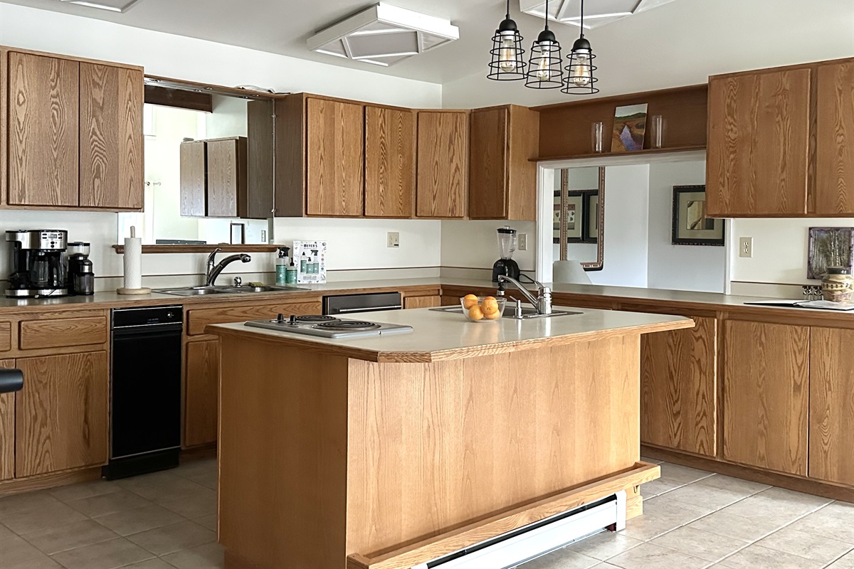 The large kitchen includes all major appliances, 6 burners, and 2 sinks! Fully stocked to cook and enjoy meals at home.