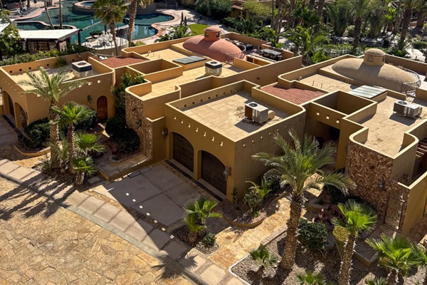 Scenic patio overlooking Bella Sirena’s lush grounds and pools.