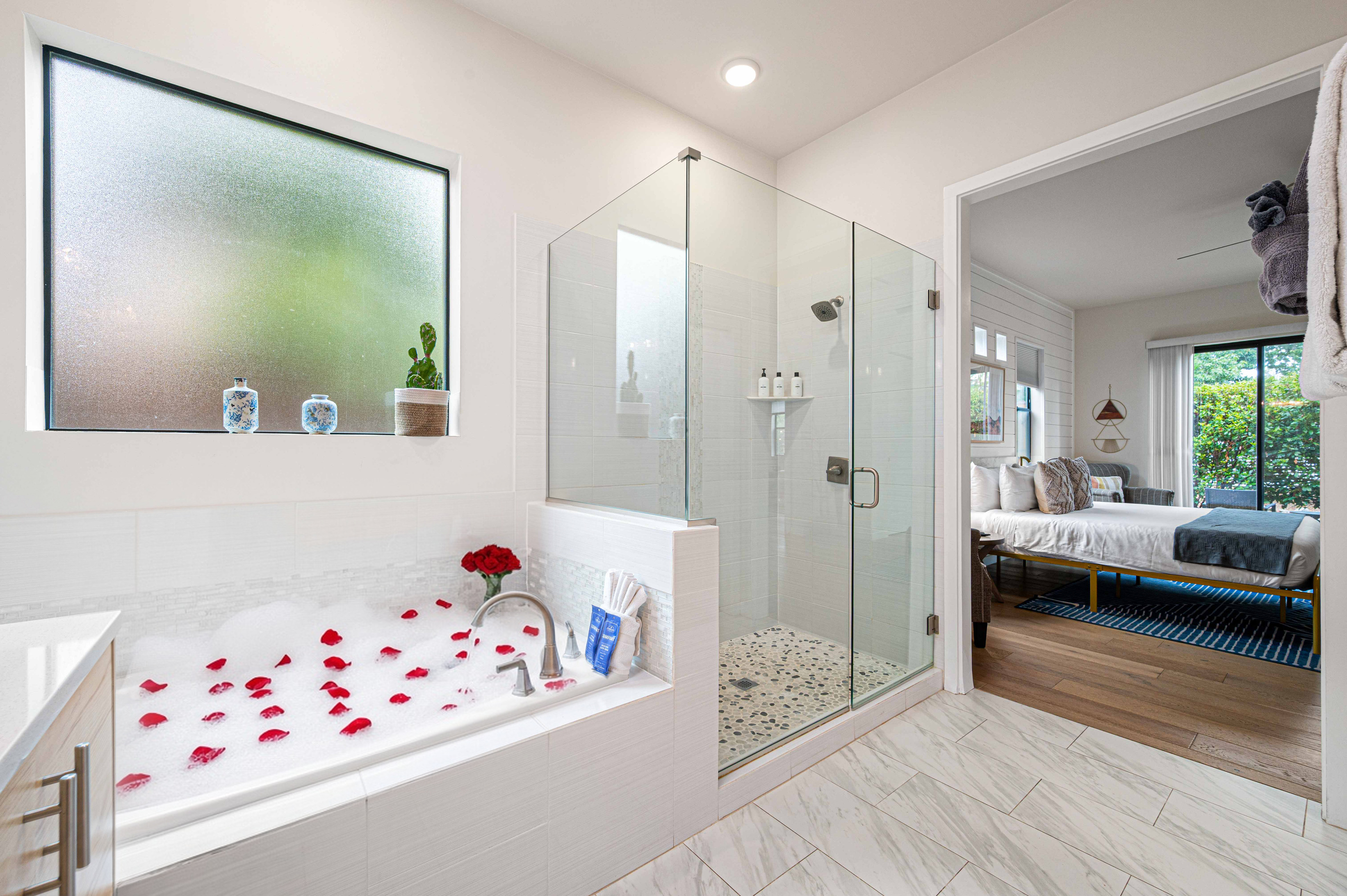 {Bedroom 1 Spa Bath} Your private ensuite features a soaking tub, walk-in shower and bright spa-like finishes.