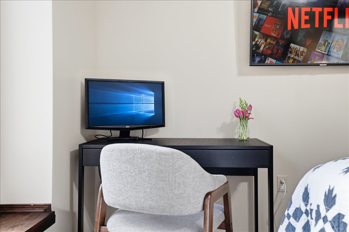 Need to sneak in some work? The bedroom desk and monitor mean you never have to sacrifice the trip
