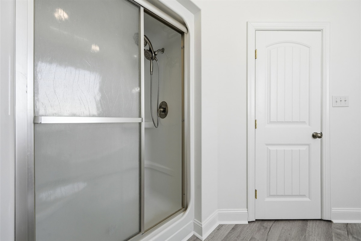 Oversized walk-in shower and private water closet add extra comfort to the master suite