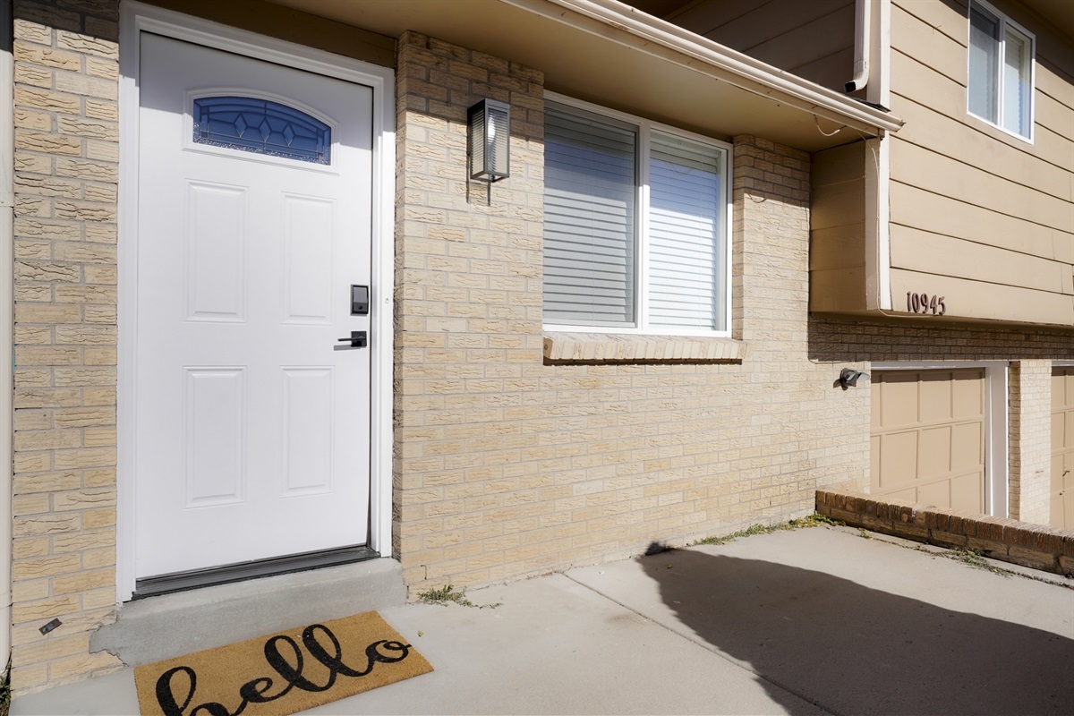 Lighted front entry way with few steps