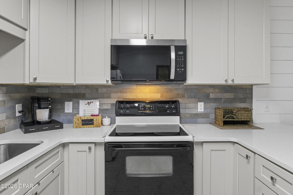 Fully equipped kitchen with everything needed for easy vacation meals, beach snacks, and family dinners during your Panama City Beach stay.