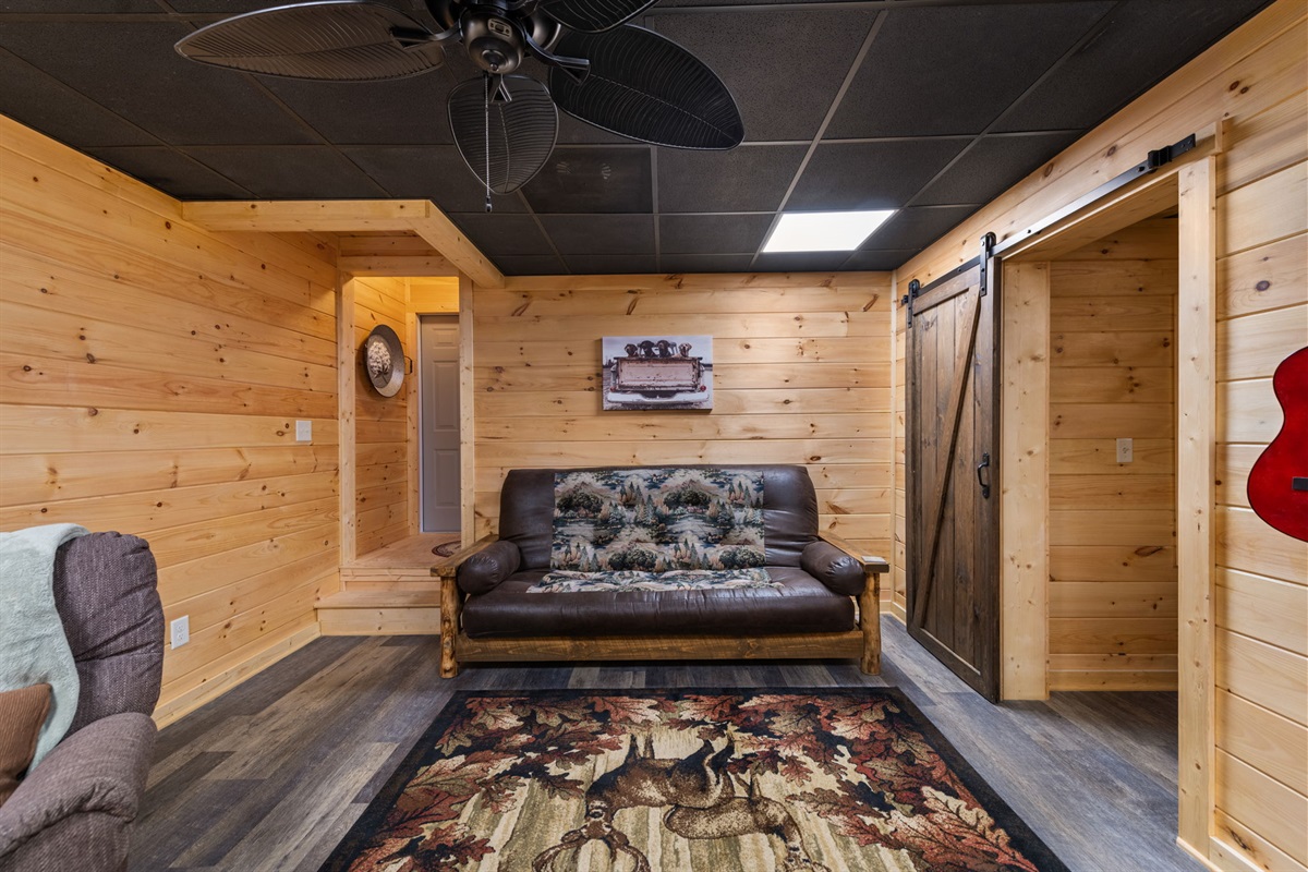 A queen-size futon is available in this area, offering additional sleeping space for guests.