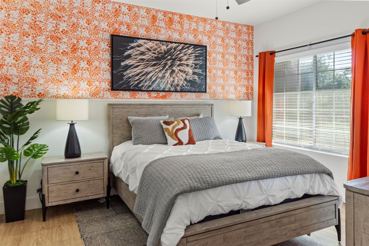 A serene retreat features a luxurious bed with premium linens, soft pillows, and a cozy mattress that ensures restful sleep and ultimate comfort throughout your visit.