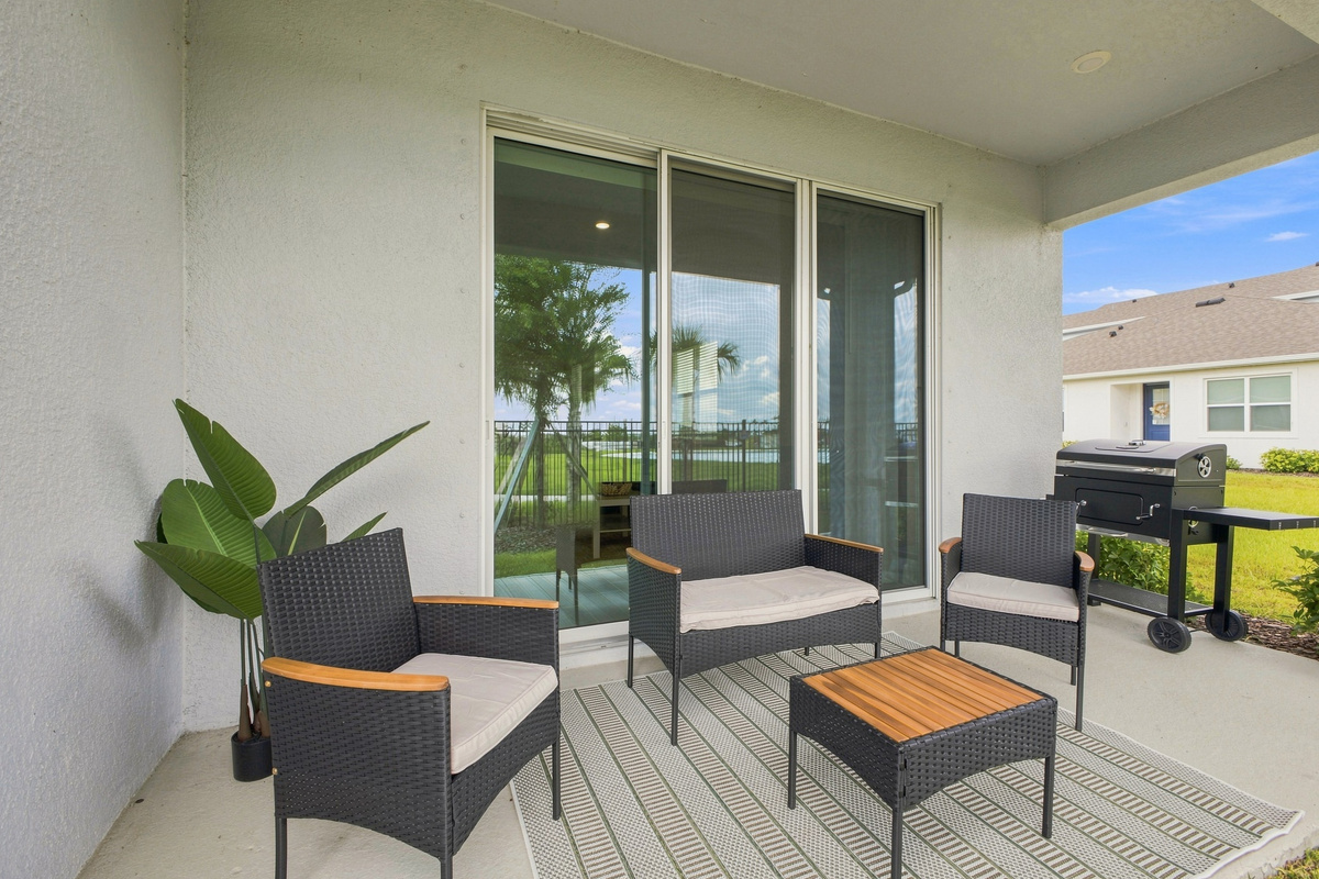 Back Porch With Outdoor Seating Area & Grill