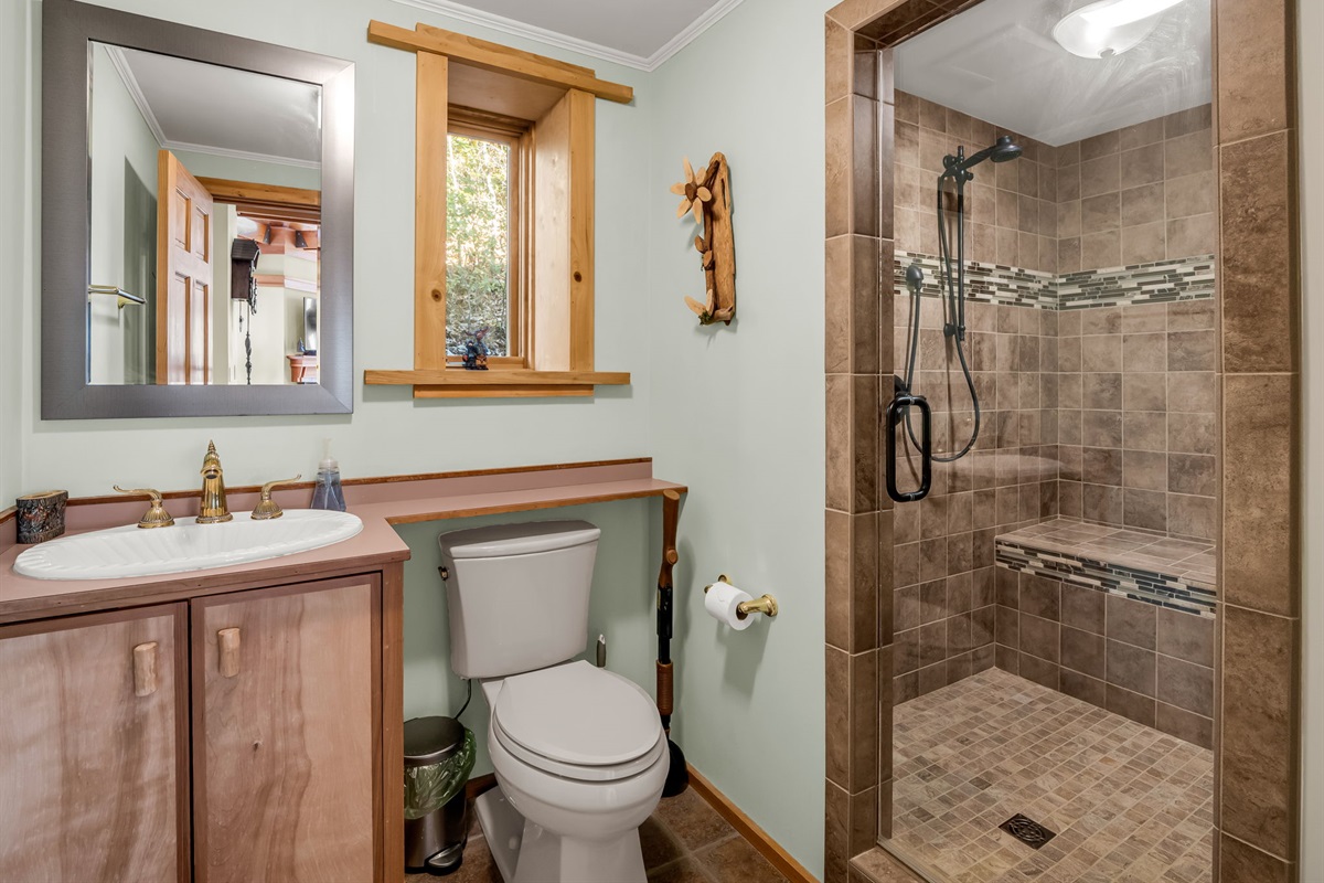 Main floor full bathroom with walk in shower.