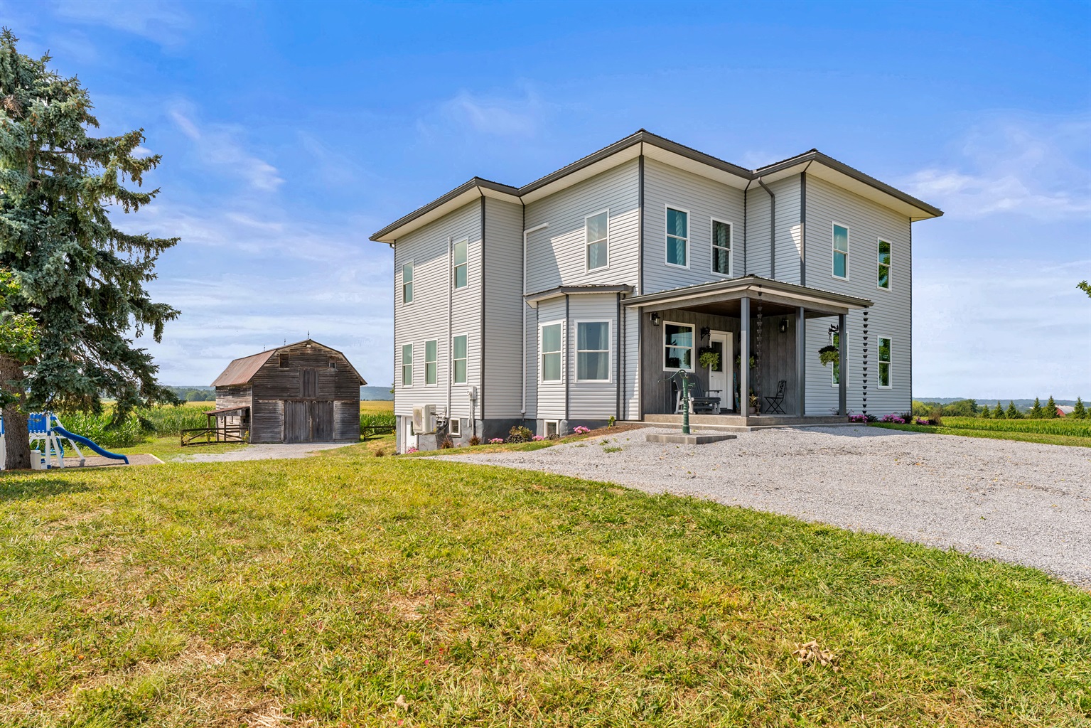 Charming countryside home with expansive yard, classic barn(Not available to guests), and scenic rural surroundings.