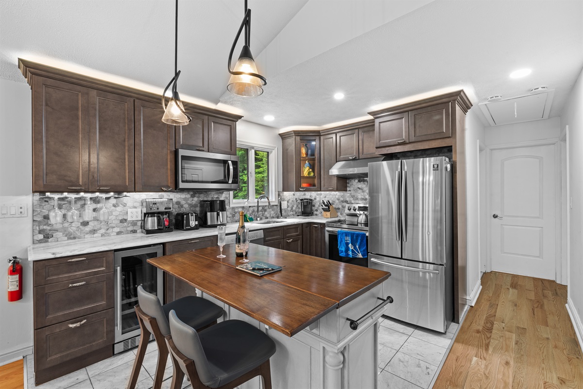 Cook with ease in this modern kitchen—includes full appliances and island counter