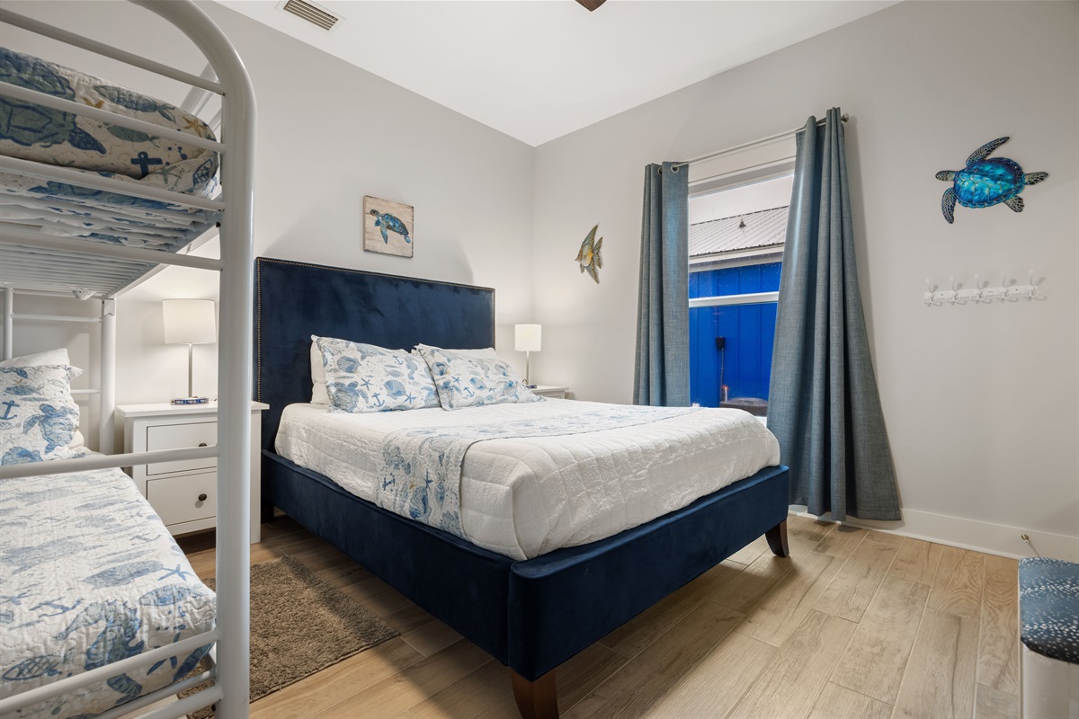 Hall Bedroom left side has a queen bed and a bunk bed