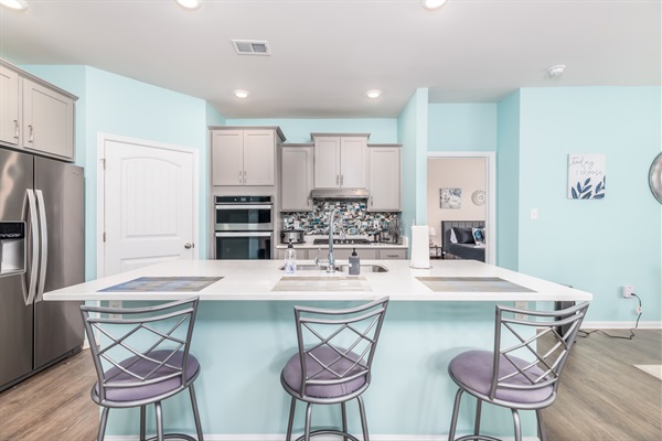 Welcome to my fully loaded, brand new kitchen! Featuring stainless steel appliances, a double oven, gas cooktop, sleek cabinets, range hood, toaster, and a spacious walk-in pantry. It's a chef