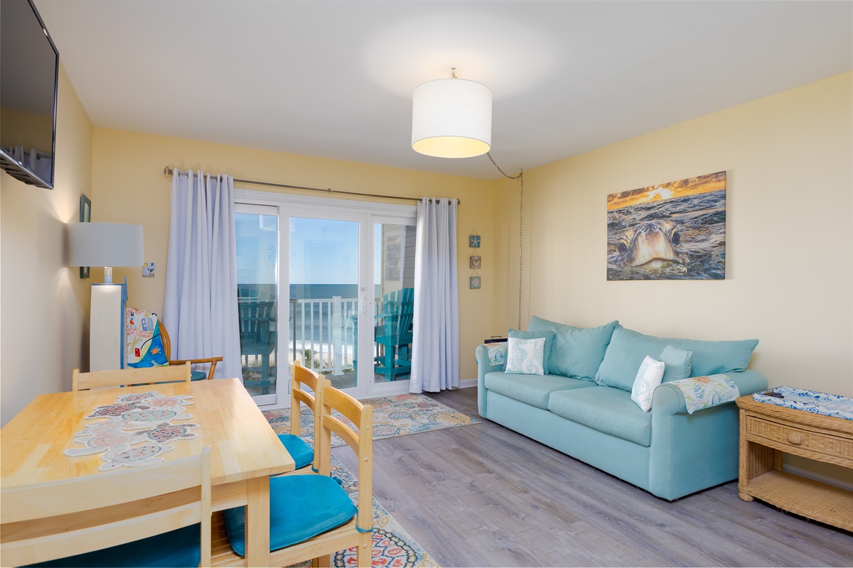 Open-concept living area with dining table and sofa