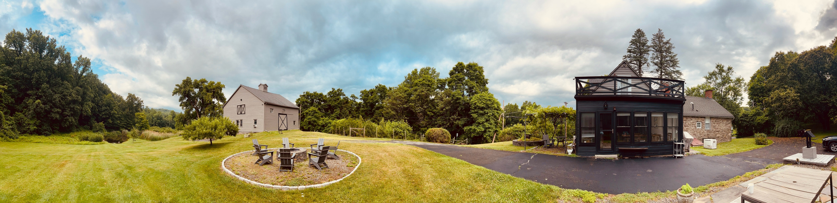 Perfect for family reunions, this property includes three separate residences: two barn apartments and the historic Stone House.