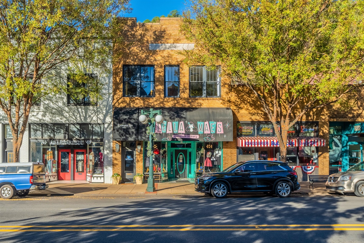 The lively atmosphere of downtown Hot Springs is reflected in its colorful storefronts and welcoming vibe, making it a must-visit spot during your stay.