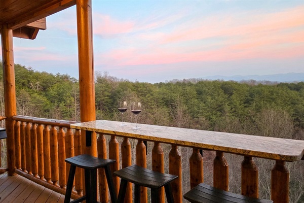 Settle down and take in the spectacular twilight views from our custom granite outdoor bar. The perfect spot to unwind after a day of adventures.