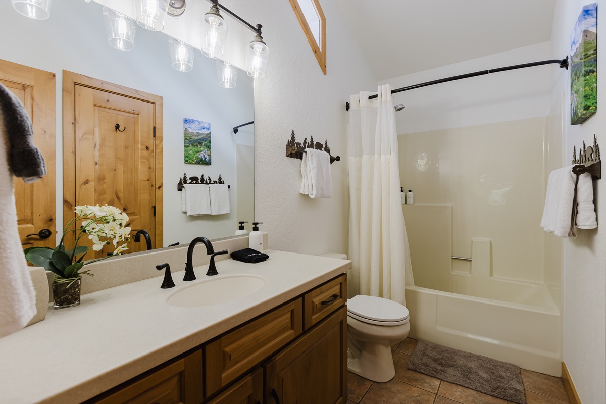 Modern guest bathroom with stylish finishes and easy upstairs access