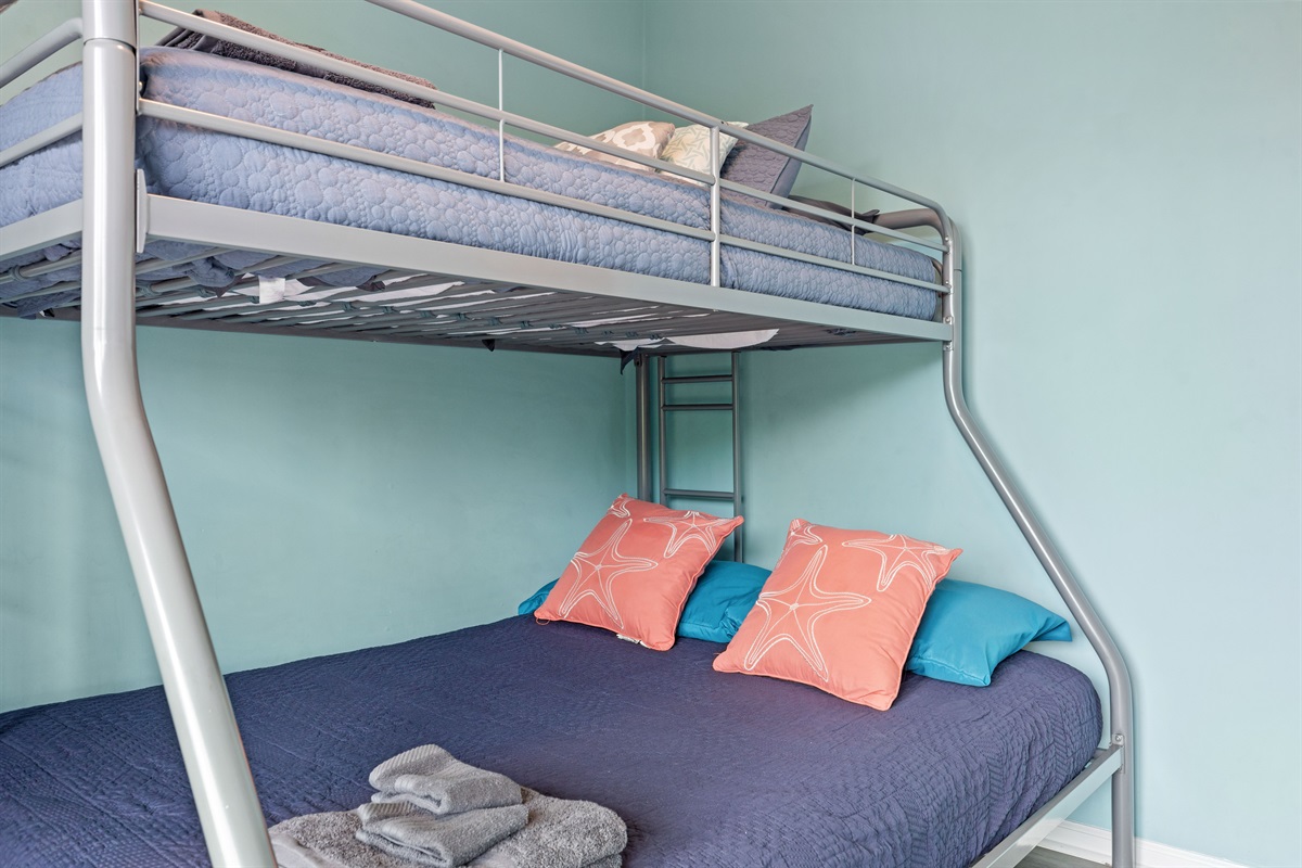 Comfortable sleeping space with coastal touches and soft tones