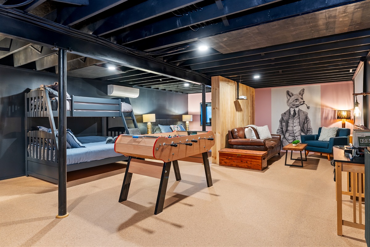 Entertainment-ready space with foosball and seating—great for groups, families, and rainy days.