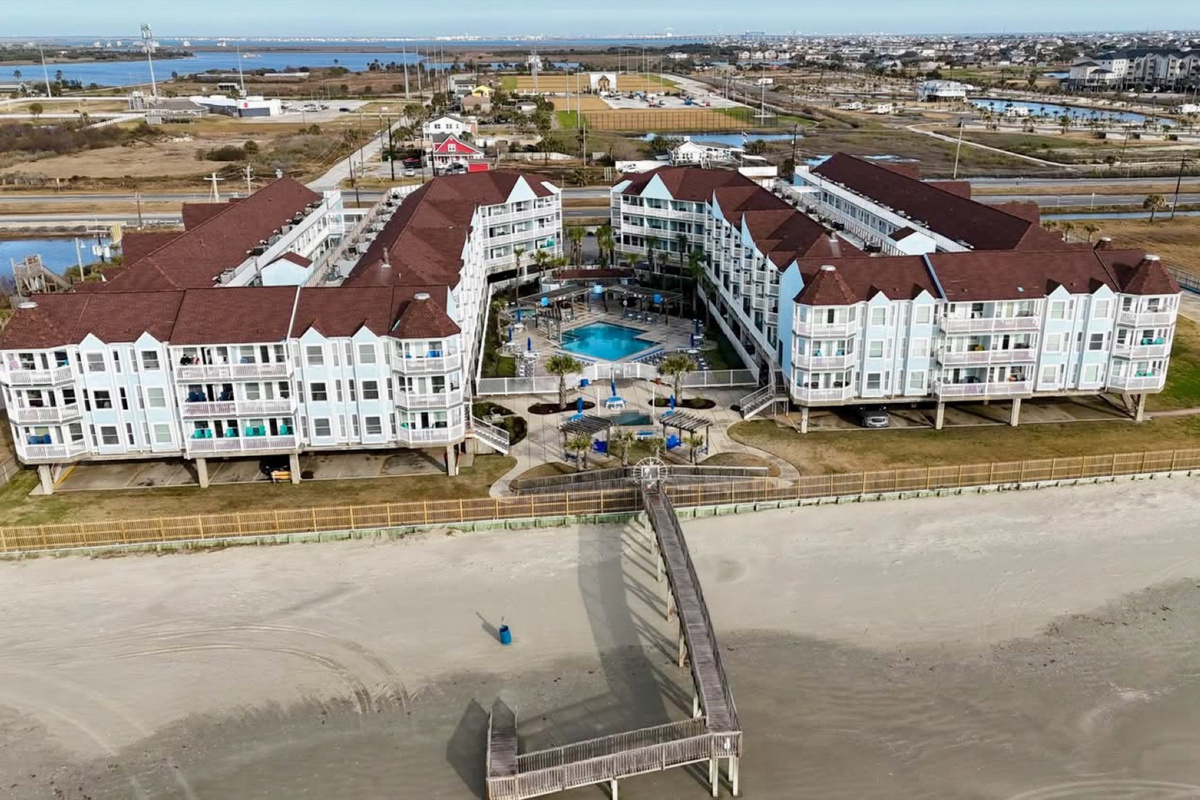Seamless beach access over the dunes—our private bridge connects you directly from the resort to the soft sand and open Gulf.
