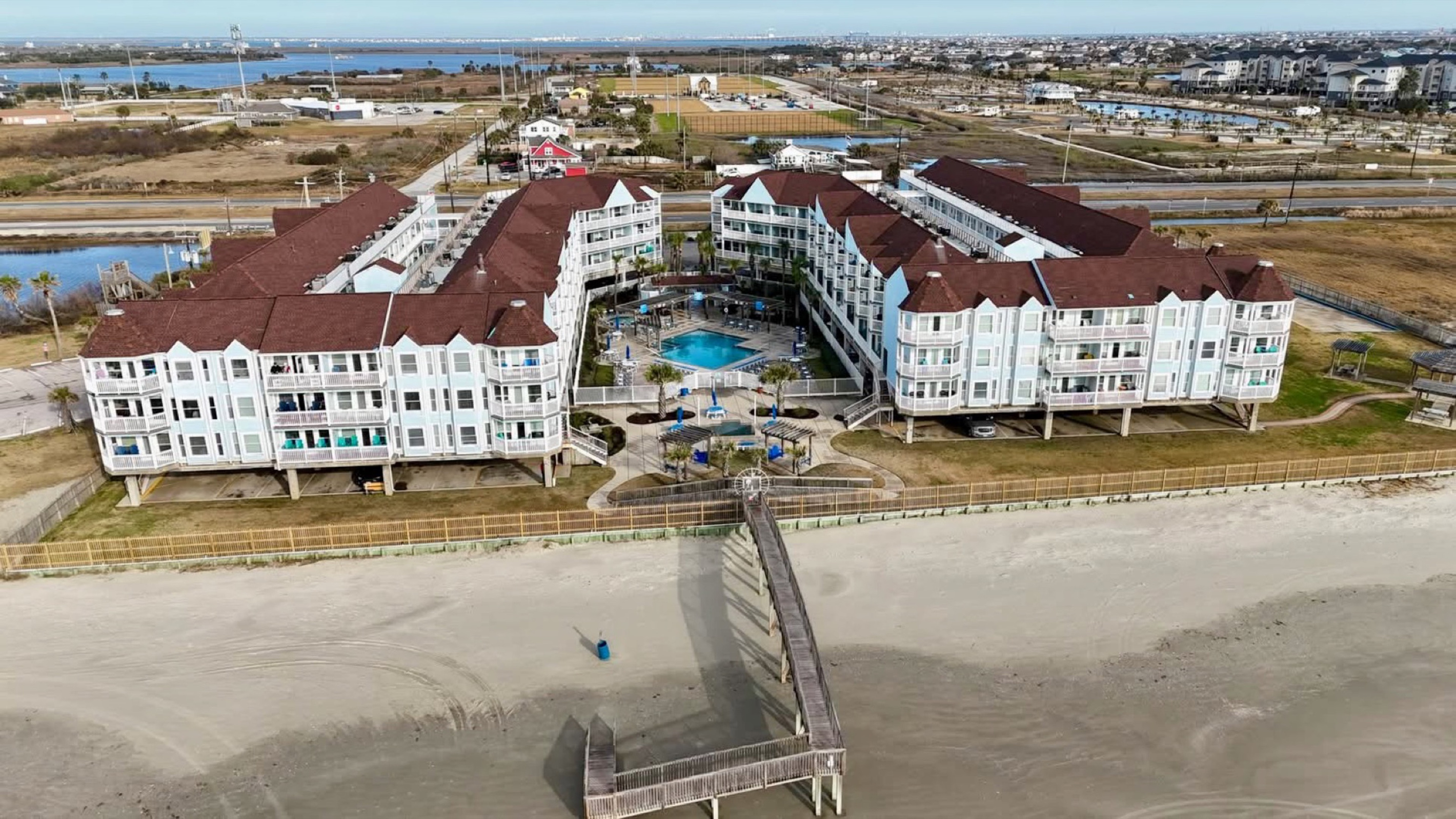 Seamless beach access over the dunes—our private bridge connects you directly from the resort to the soft sand and open Gulf.
