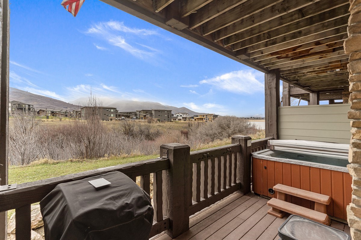 Outdoor deck with grill and seating for relaxing evenings.