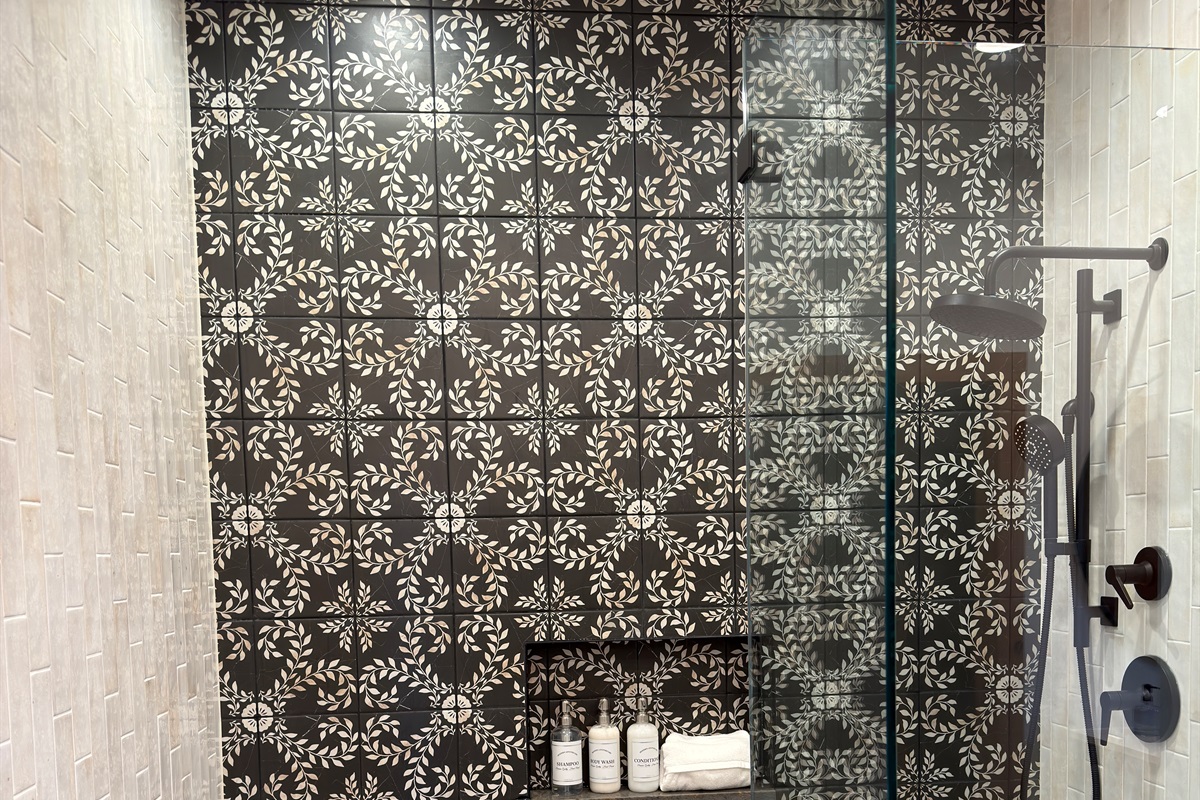Elegantly designed and executed tile master ensuite shower with Kohler Showerhead and Hydro-Rail hand shower.