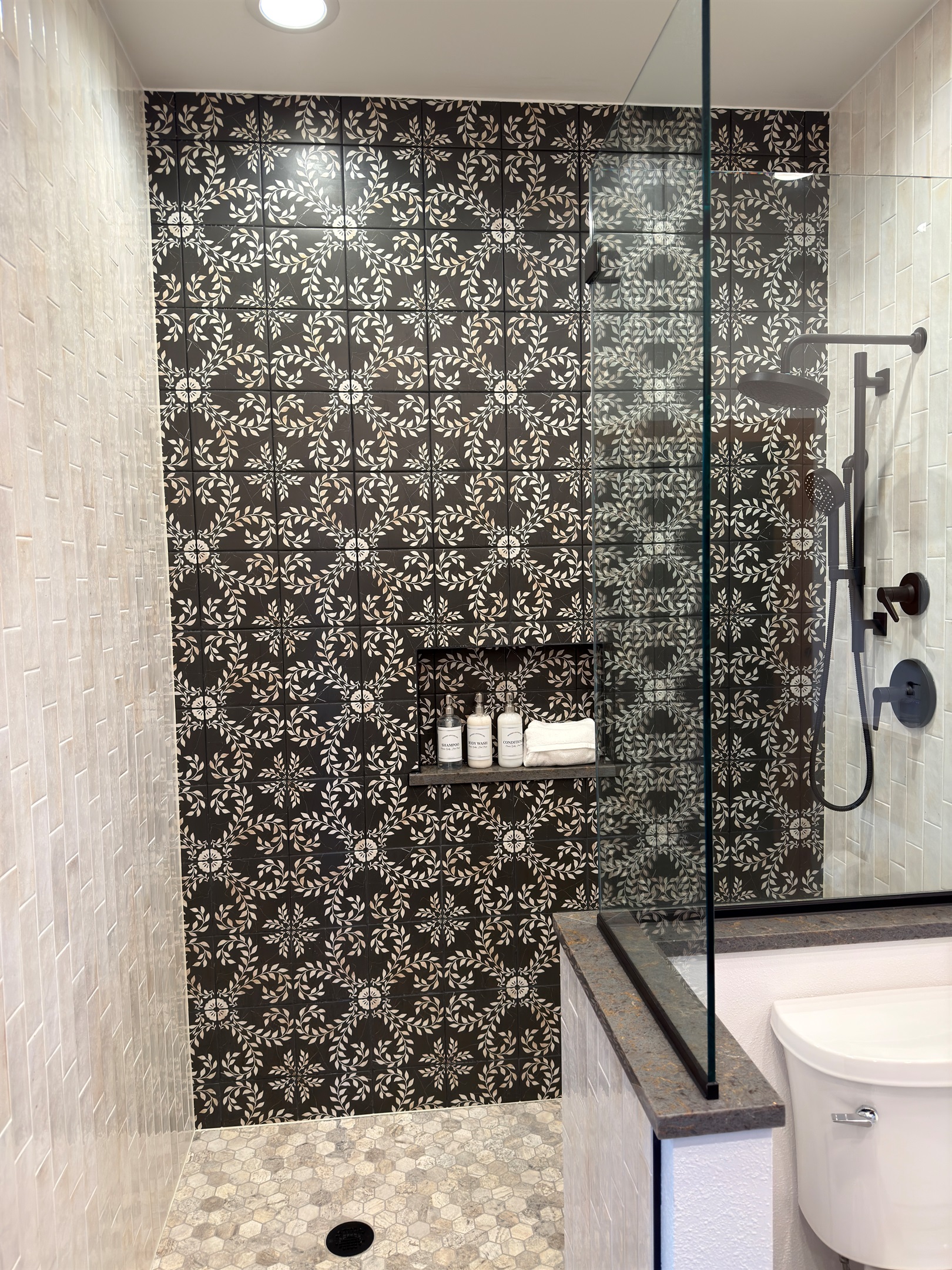 Elegantly designed and executed tile master ensuite shower with Kohler Showerhead and Hydro-Rail hand shower.