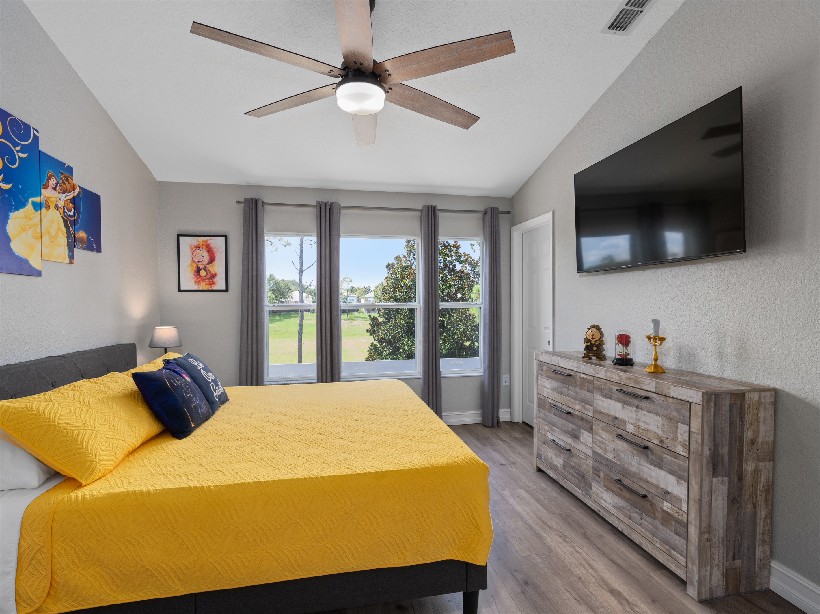 Spacious king primary suite with Beauty and the Beast touches